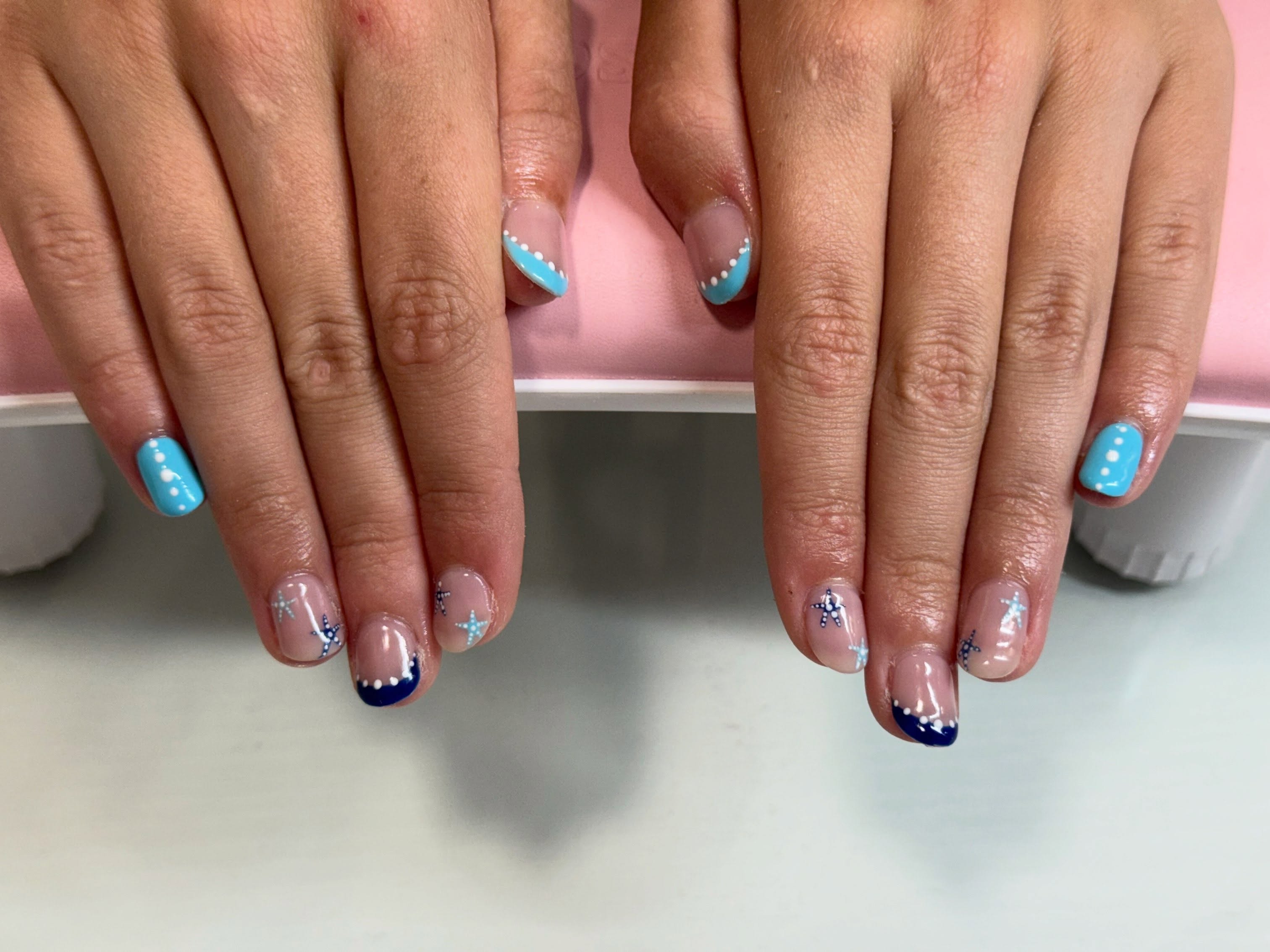 Blue French tip gel set with star accents by Polished by Bug in Cedar City, Utah